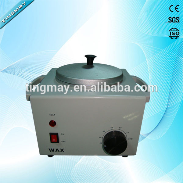 Small hand held roller wax heater